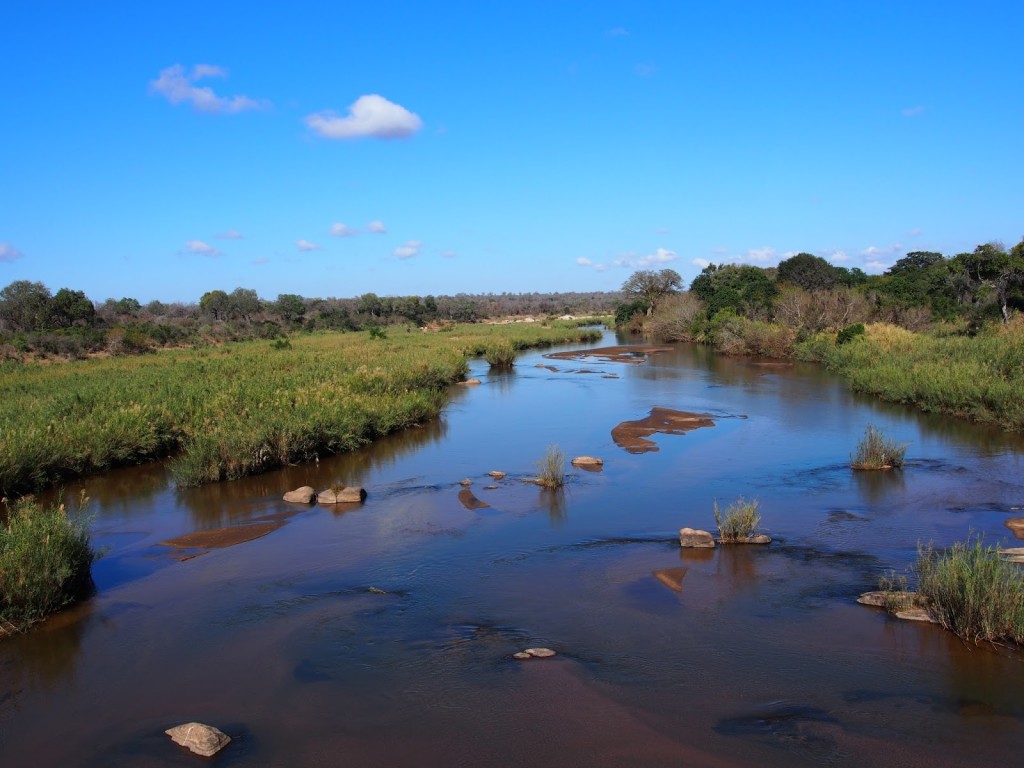 View of the river that passes the bridge at the entrance