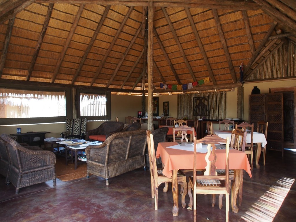 On the inside, where people can chill on the couch to read the various books on wildlife. 