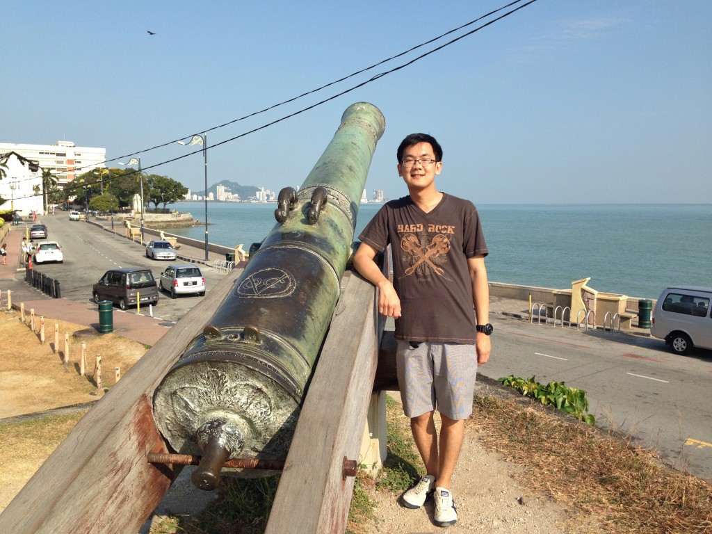 Standing next to a cannon in Fort Cornwallis