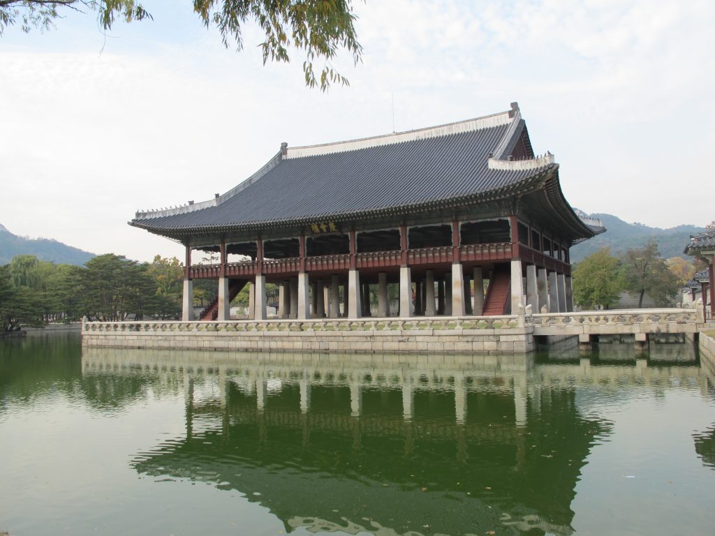 Pond with a building in the middle.