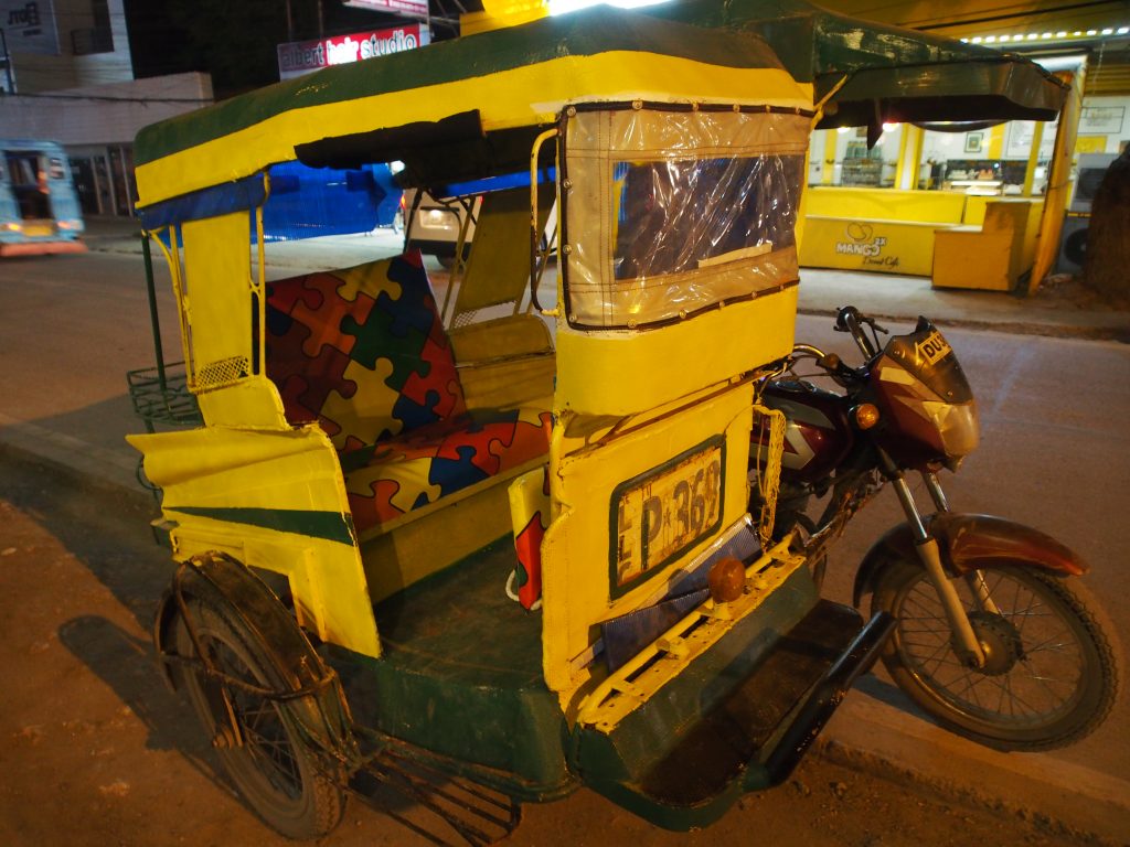 Motor tricycle that we took to return back.