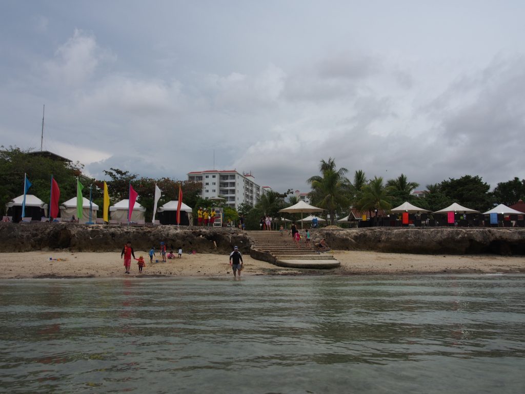 A view of the beach standing in the waters.